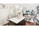 Bright kitchen featuring pendant lighting and a marble island with barstool seating and adjacent dining area at 1006 Cherry Tree Ln, Greenwood, IN 46143