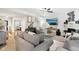 Open-concept living room with stylish decor, hardwood floors, piano, and seamless transition to the dining area at 1006 Cherry Tree Ln, Greenwood, IN 46143