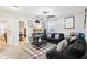 Cozy living room featuring a black sofa, stylish decor, and open access to a workspace area at 1006 Cherry Tree Ln, Greenwood, IN 46143