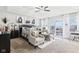 Inviting main bedroom with elegant decor, tray ceilings, and access to an outdoor seating area at 1006 Cherry Tree Ln, Greenwood, IN 46143