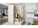 Elegant tiled shower with glass door, shower bench, and window for natural light at 1006 Cherry Tree Ln, Greenwood, IN 46143