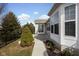 Well-manicured backyard features walkway to patio, lush landscaping, and view of exterior windows at 13998 Avalon Blvd, Fishers, IN 46037
