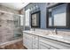 Stylish bathroom features dual sinks, granite countertops, and a tiled shower with a glass door at 13998 Avalon Blvd, Fishers, IN 46037