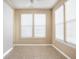 Bright dining area features tiled floor, ample windows, and neutral paint at 13998 Avalon Blvd, Fishers, IN 46037