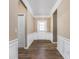 Spacious foyer with hardwood floors and elegant wainscoting at 13998 Avalon Blvd, Fishers, IN 46037