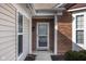 Inviting front entrance with brick accents and a storm door at 13998 Avalon Blvd, Fishers, IN 46037
