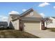 Attached two-car garage with brick facade and siding, offering convenient parking at 13998 Avalon Blvd, Fishers, IN 46037