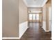 Hallway with hardwood floors leading to the living area and bedrooms at 13998 Avalon Blvd, Fishers, IN 46037