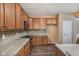 Well-lit kitchen featuring wood cabinets, tiled backsplash and stainless steel appliances at 13998 Avalon Blvd, Fishers, IN 46037