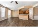 Open-concept living area with hardwood floors and seamless transition to the kitchen at 13998 Avalon Blvd, Fishers, IN 46037