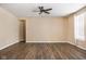 Bright living room with hardwood floors and a ceiling fan at 13998 Avalon Blvd, Fishers, IN 46037