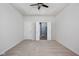 Spacious bedroom with a tray ceiling, ceiling fan, and adjoining bathroom at 13998 Avalon Blvd, Fishers, IN 46037
