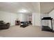 This is a spacious finished basement area with a recreational pool table, adjacent to an exercise area and a relaxer at 1563 Old Thicket Ct, Greenwood, IN 46143