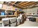 This is an unfinished storage area in the basement with exposed joists and organized storage containers at 1563 Old Thicket Ct, Greenwood, IN 46143