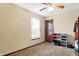 Bedroom featuring carpet, a multi-colored ceiling fan, a closet, and a large window at 1563 Old Thicket Ct, Greenwood, IN 46143