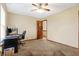 This bedroom showcases a door leading to another room and a ceiling fan, blending functionality with a relaxing atmosphere at 1563 Old Thicket Ct, Greenwood, IN 46143