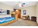 bedroom featuring carpet, a multi-colored ceiling fan, bunk beds, a desk, and a closet at 1563 Old Thicket Ct, Greenwood, IN 46143