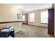 Upstairs hallway with carpet leads to rooms, filled with natural light from windows, creating a bright space at 1563 Old Thicket Ct, Greenwood, IN 46143