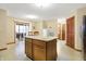 Bright kitchen with center island, stainless appliances, and adjacent eating area at 1563 Old Thicket Ct, Greenwood, IN 46143