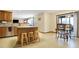 Kitchen with island, stainless appliances, table and a sliding glass door to the porch at 1563 Old Thicket Ct, Greenwood, IN 46143