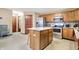 Well-lit kitchen features a center island, stainless steel appliances, and ample cabinet space at 1563 Old Thicket Ct, Greenwood, IN 46143