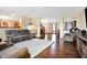 Open-concept living room with hardwood floors and seamless flow to other areas at 1563 Old Thicket Ct, Greenwood, IN 46143