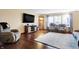 Inviting living room featuring hardwood floors, large TV, and comfortable seating at 1563 Old Thicket Ct, Greenwood, IN 46143