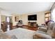 Cozy living room with hardwood floors, comfortable recliners, and a large wall-mounted television at 1563 Old Thicket Ct, Greenwood, IN 46143