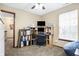 Office featuring carpet, a ceiling fan, a large window, shelving, and a built-in desk at 1563 Old Thicket Ct, Greenwood, IN 46143