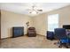 Office featuring carpet, a ceiling fan, a large window, a dresser, a recliner, and a built-in desk at 1563 Old Thicket Ct, Greenwood, IN 46143