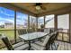This is an outdoor screened porch with table and chair seating for outdoor relaxation and entertaining at 1563 Old Thicket Ct, Greenwood, IN 46143
