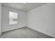 Bright bedroom with neutral walls, carpeted floor, and a window with natural light at 1934 Black Oak Dr, Shelbyville, IN 46176