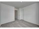 Spacious bedroom with plush gray carpet, neutral walls, and doorways to hall and closet at 1934 Black Oak Dr, Shelbyville, IN 46176