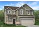 Charming two-story home with an attached two-car garage, brick accents, green siding and a well-manicured lawn with landscaping at 1934 Black Oak Dr, Shelbyville, IN 46176
