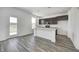 This kitchen has dark cabinets and a white island with stainless steel appliances at 1934 Black Oak Dr, Shelbyville, IN 46176