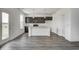 This kitchen has dark cabinets and a white island at 1934 Black Oak Dr, Shelbyville, IN 46176