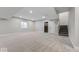 Spacious finished basement with neutral carpet, recessed lighting and access to stairs at 19997 Old Dock Rd, Westfield, IN 46074