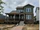 Charming two-story home featuring a welcoming front porch and a combination of brick and siding exterior at 19997 Old Dock Rd, Westfield, IN 46074