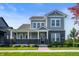 Charming two-story home with gray siding, brick accents, and a welcoming front porch at 19997 Old Dock Rd, Westfield, IN 46074