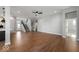 Large living room with hardwood floors, open floor plan, and access to kitchen and staircase at 19997 Old Dock Rd, Westfield, IN 46074