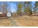 Backyard featuring a basketball court and shed at 2016 Colt Rd, Indianapolis, IN 46227