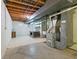 Spacious basement with exposed ceiling and vintage desk at 2016 Colt Rd, Indianapolis, IN 46227
