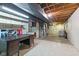 Large finished basement featuring shelving, furnace, desk and laundry area at 2016 Colt Rd, Indianapolis, IN 46227