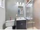 Modern bathroom featuring a vanity, tiled shower with glass door, and ceramic tile at 2016 Colt Rd, Indianapolis, IN 46227