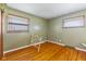 Cozy bedroom with hardwood floors, natural light, and neutral color palette at 2016 Colt Rd, Indianapolis, IN 46227