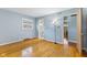 This bedroom has hard wood floors, a window, and conveniently located next to a bathroom at 2016 Colt Rd, Indianapolis, IN 46227