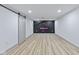 Finished basement featuring an electric fireplace and sliding barn door at 218 W 31St St, Indianapolis, IN 46208