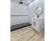 Modern bathroom featuring a walk-in shower with marble-style tile and a sleek black fixture at 218 W 31St St, Indianapolis, IN 46208