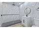 Modern bathroom with stand-up shower, vanity with a modern sink and toilet; bright and clean design at 218 W 31St St, Indianapolis, IN 46208