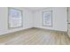 Bright bedroom with two large windows offering ample natural light, complemented by light-colored floors at 218 W 31St St, Indianapolis, IN 46208